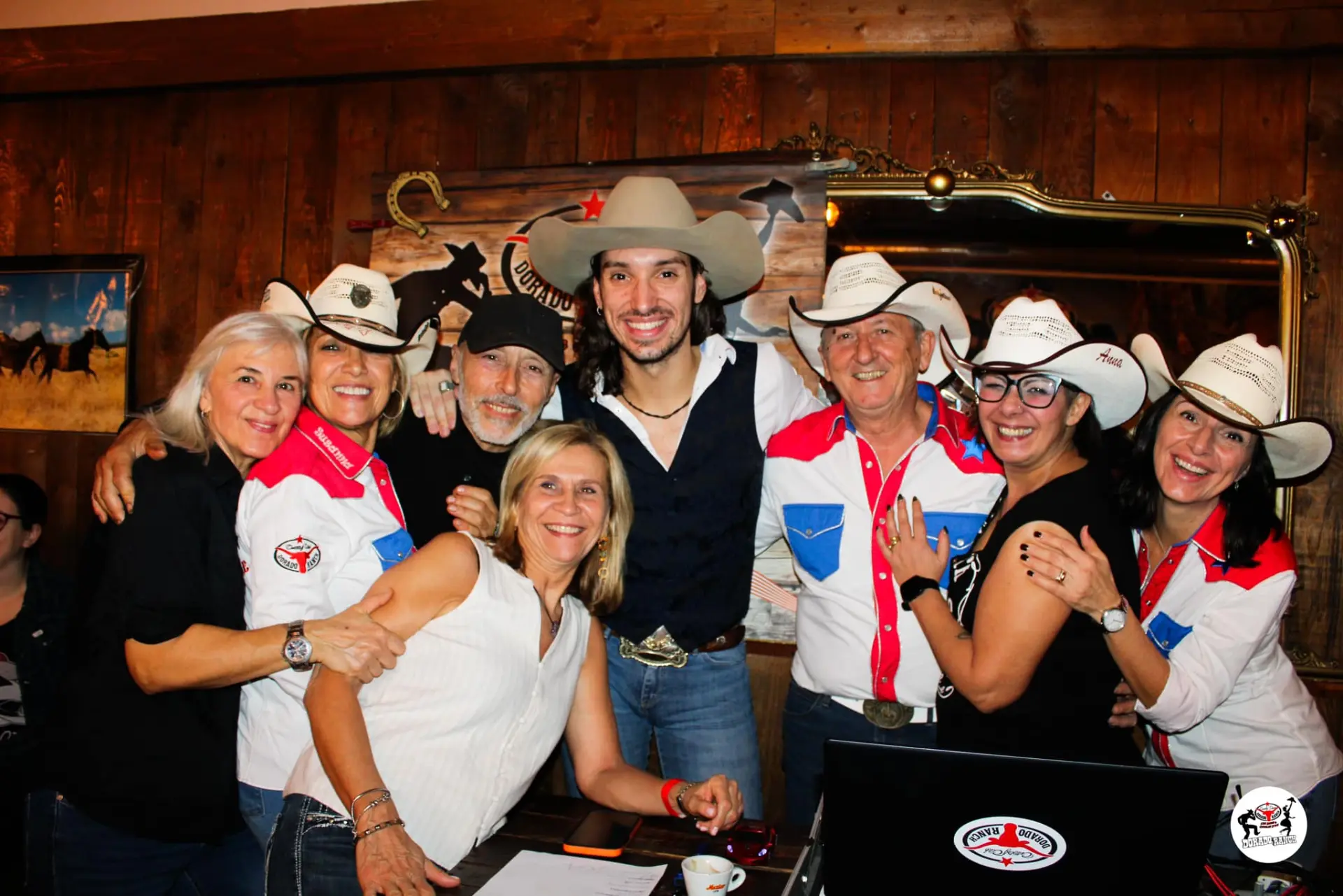 Johnny Rossato surrounded by smiling members of the Dorado Ranch Country Dance club